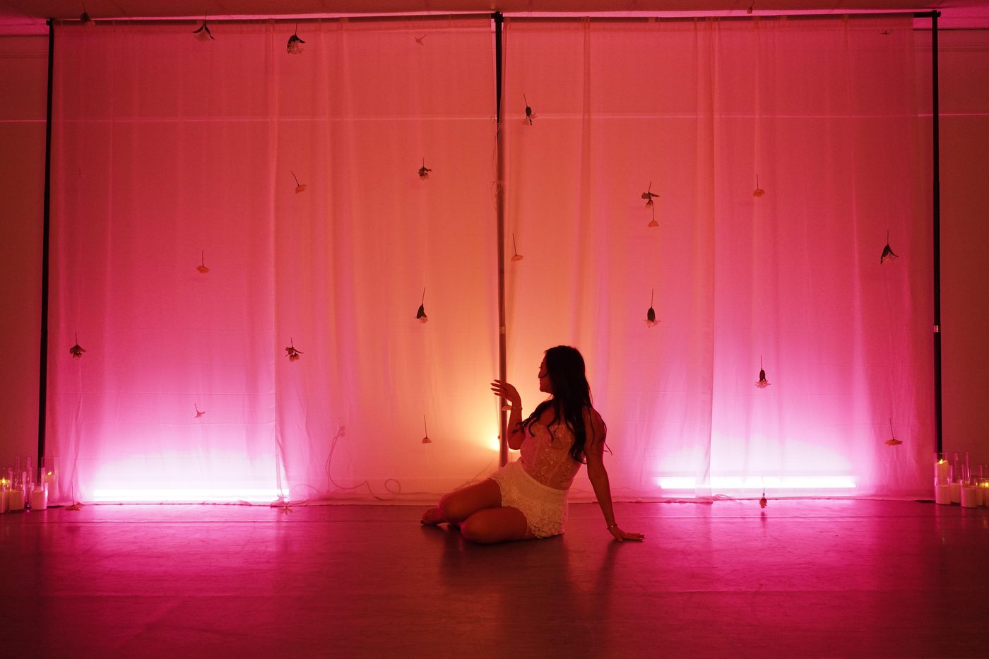 Bachelorette celebration with dramatic pink ambient lighting